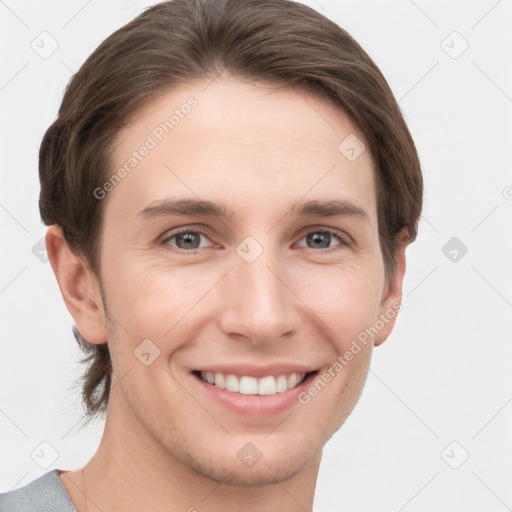 Joyful white young-adult female with short  brown hair and grey eyes