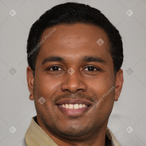 Joyful latino young-adult male with short  black hair and brown eyes