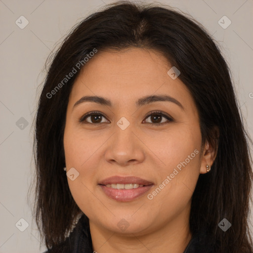 Joyful latino young-adult female with long  brown hair and brown eyes