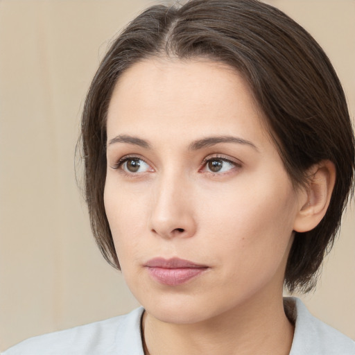 Neutral white young-adult female with medium  brown hair and brown eyes