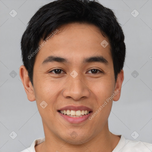 Joyful asian young-adult male with short  black hair and brown eyes