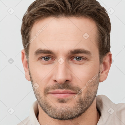 Joyful white young-adult male with short  brown hair and brown eyes