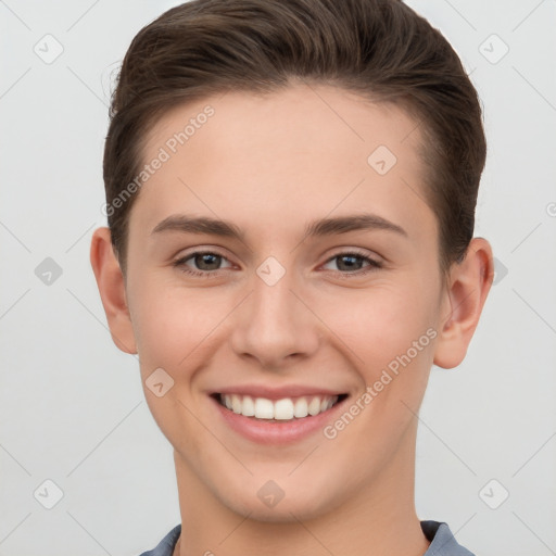 Joyful white young-adult female with short  brown hair and grey eyes