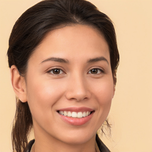 Joyful white young-adult female with long  brown hair and brown eyes