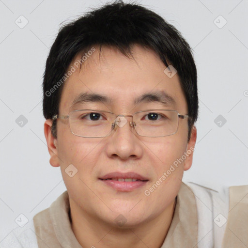 Joyful asian adult male with short  brown hair and brown eyes