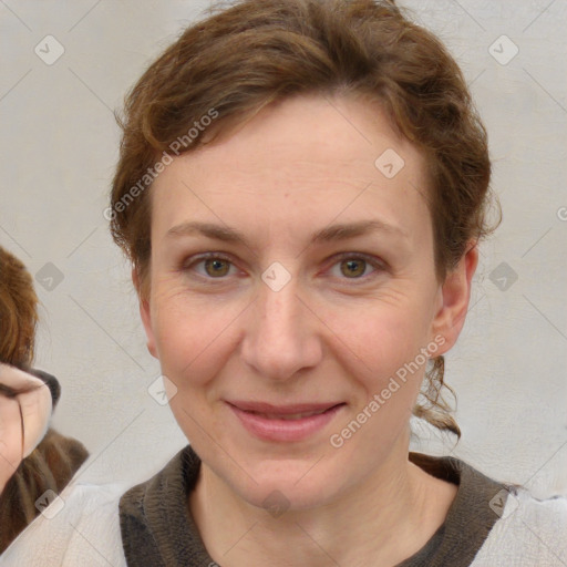 Joyful white adult female with medium  brown hair and blue eyes