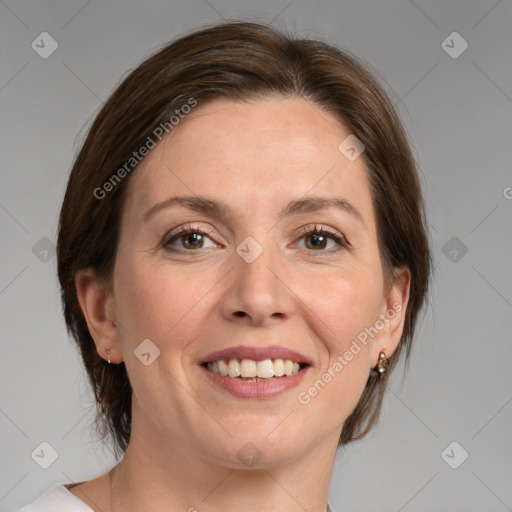 Joyful white adult female with medium  brown hair and grey eyes