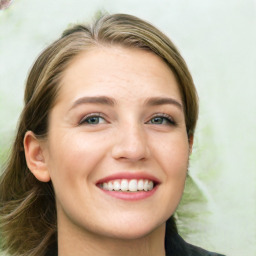 Joyful white young-adult female with long  brown hair and green eyes