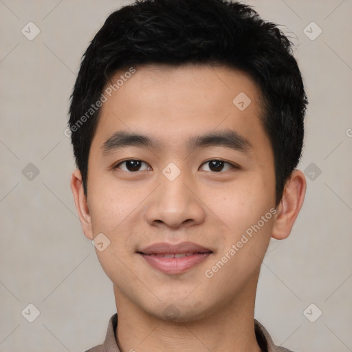 Joyful asian young-adult male with short  black hair and brown eyes