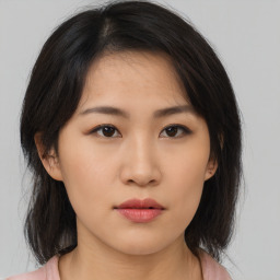 Neutral asian young-adult female with medium  brown hair and brown eyes