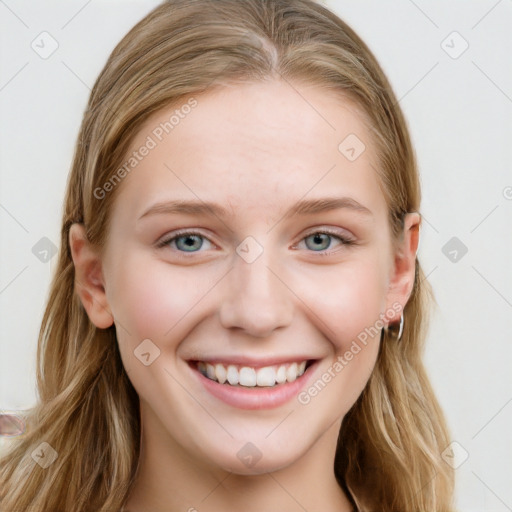 Joyful white young-adult female with long  brown hair and blue eyes