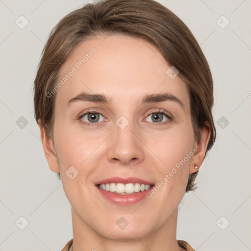 Joyful white young-adult female with short  brown hair and grey eyes