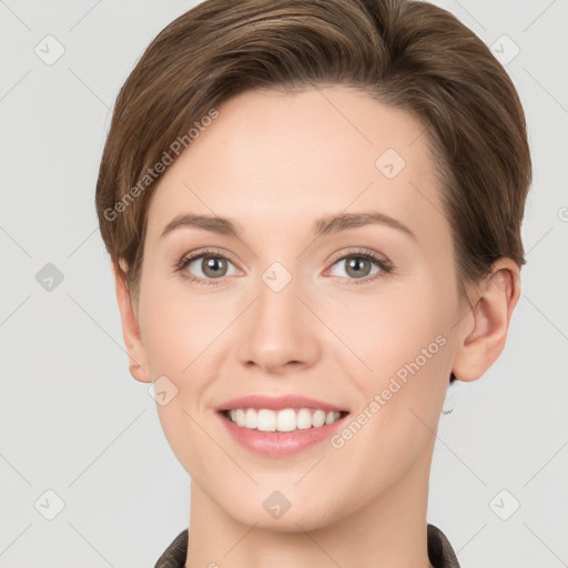 Joyful white young-adult female with short  brown hair and grey eyes