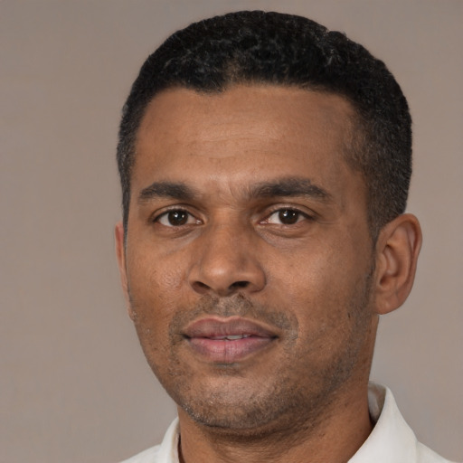 Neutral black adult male with short  black hair and brown eyes