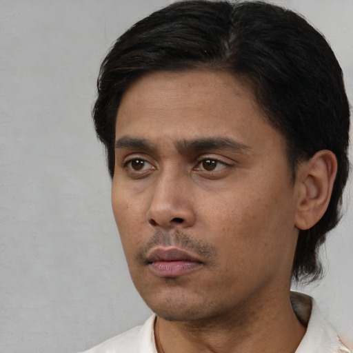 Neutral white young-adult male with short  black hair and brown eyes