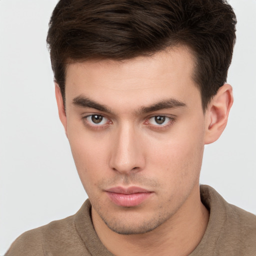 Neutral white young-adult male with short  brown hair and brown eyes