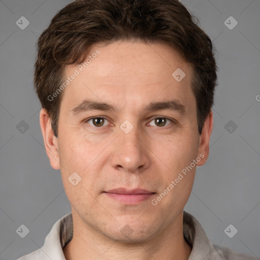 Joyful white adult male with short  brown hair and brown eyes