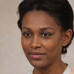 Joyful black young-adult female with medium  brown hair and brown eyes