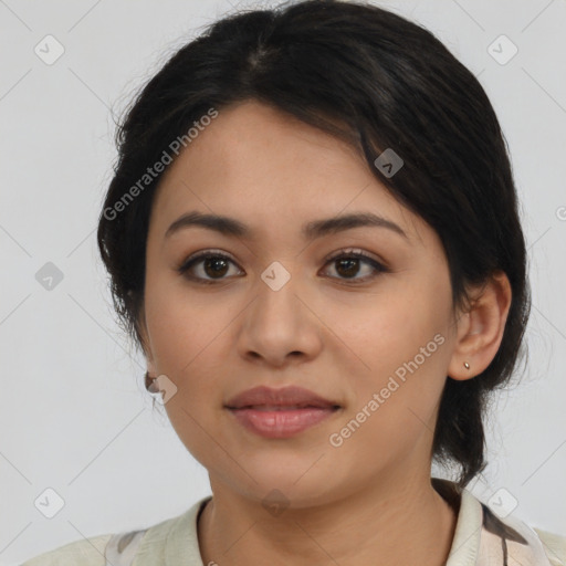 Joyful latino young-adult female with medium  brown hair and brown eyes