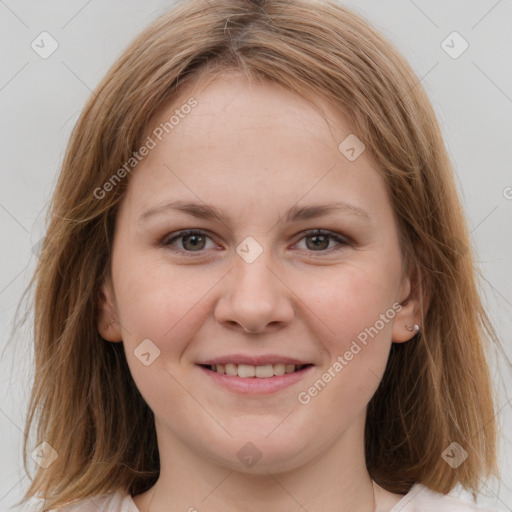 Joyful white young-adult female with medium  brown hair and grey eyes