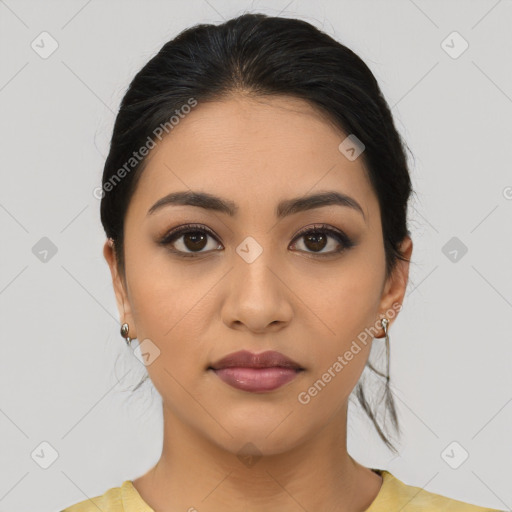 Joyful latino young-adult female with medium  brown hair and brown eyes