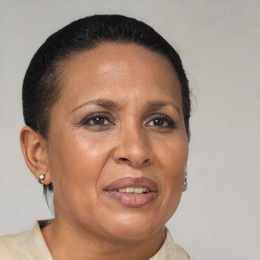 Joyful black adult female with short  brown hair and brown eyes