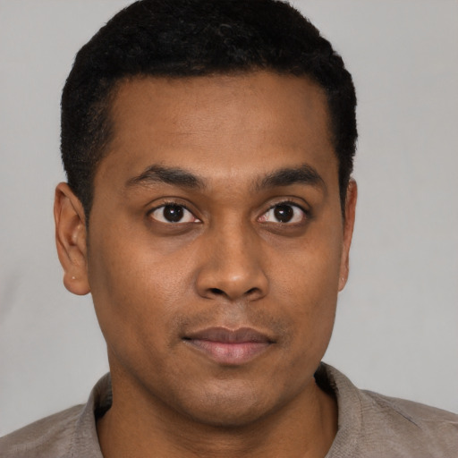 Neutral black young-adult male with short  brown hair and brown eyes