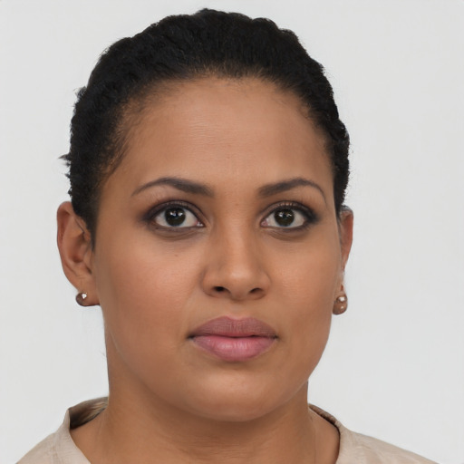Joyful latino young-adult female with short  brown hair and brown eyes