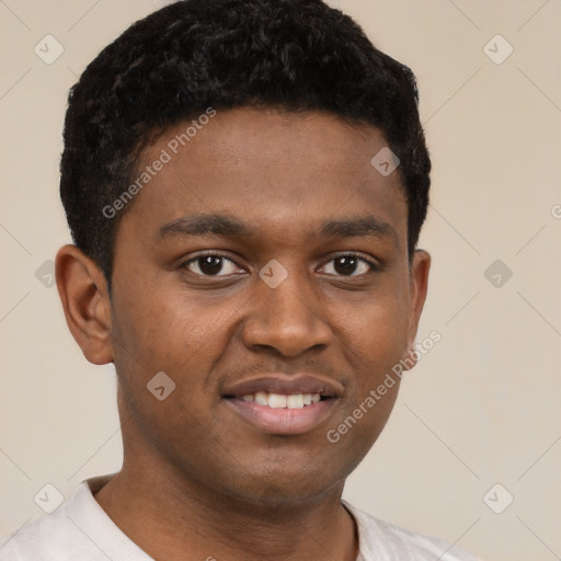 Joyful black young-adult male with short  brown hair and brown eyes