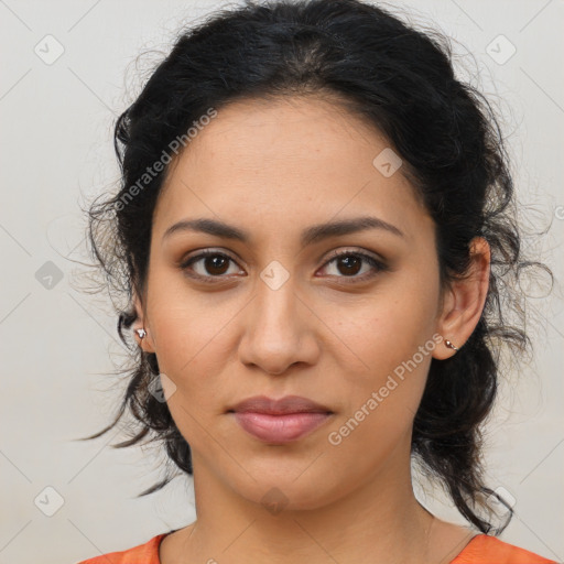 Joyful latino young-adult female with medium  brown hair and brown eyes