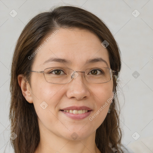 Joyful white adult female with long  brown hair and brown eyes