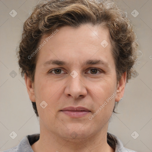 Joyful white adult male with short  brown hair and grey eyes