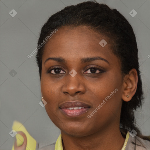 Joyful black young-adult female with short  brown hair and brown eyes