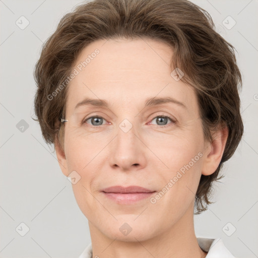 Joyful white adult female with short  brown hair and grey eyes