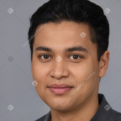 Joyful white young-adult male with short  black hair and brown eyes