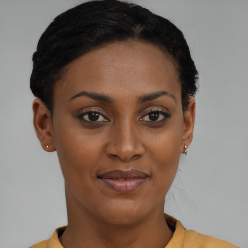 Joyful latino young-adult female with short  brown hair and brown eyes