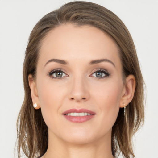 Joyful white young-adult female with long  brown hair and grey eyes