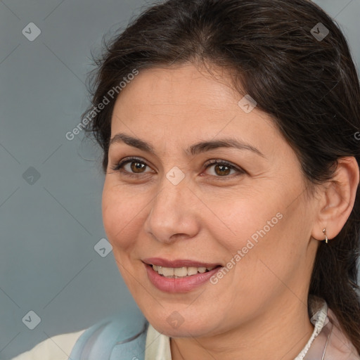 Joyful white adult female with medium  brown hair and brown eyes