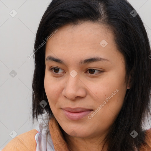 Joyful latino young-adult female with long  brown hair and brown eyes