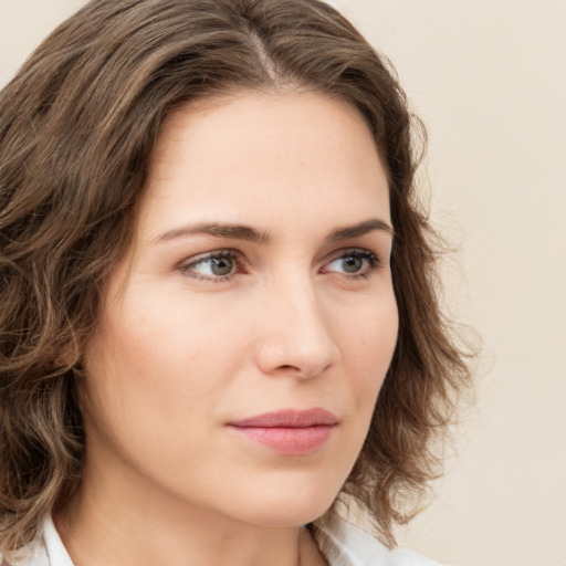 Neutral white young-adult female with medium  brown hair and green eyes