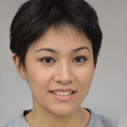 Joyful asian young-adult female with short  brown hair and brown eyes