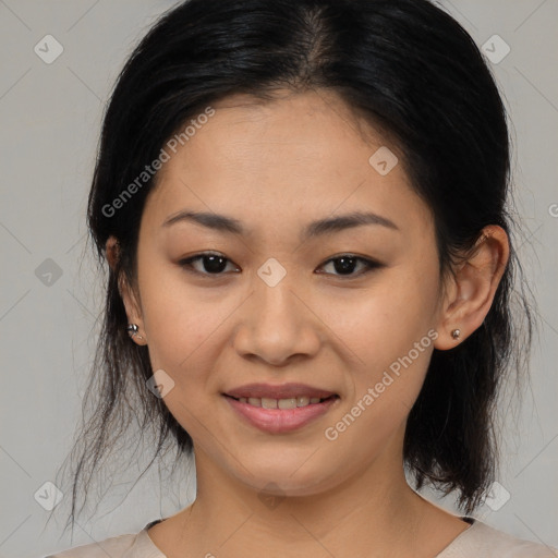 Joyful latino young-adult female with medium  black hair and brown eyes