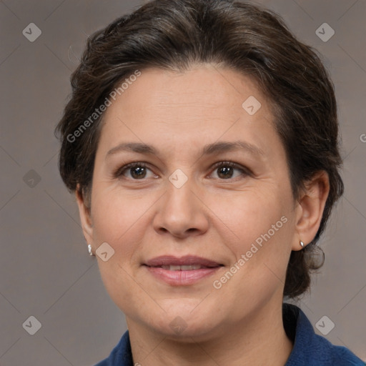 Joyful white adult female with short  brown hair and brown eyes