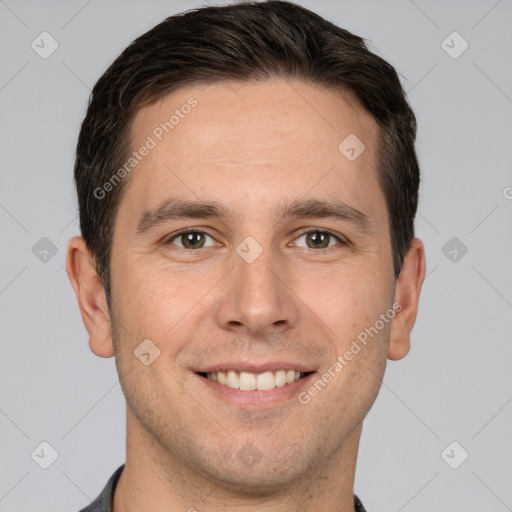 Joyful white young-adult male with short  brown hair and brown eyes