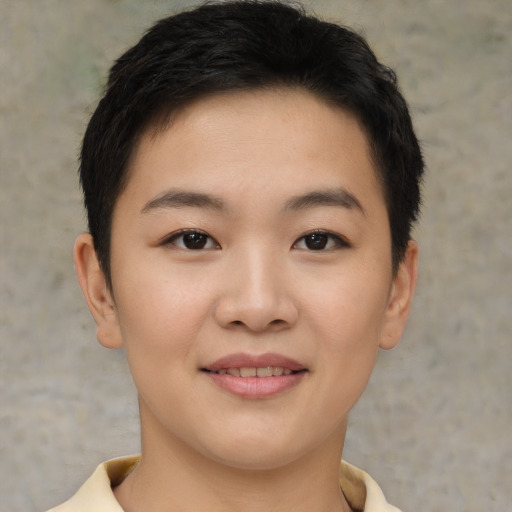Joyful asian young-adult female with short  brown hair and brown eyes