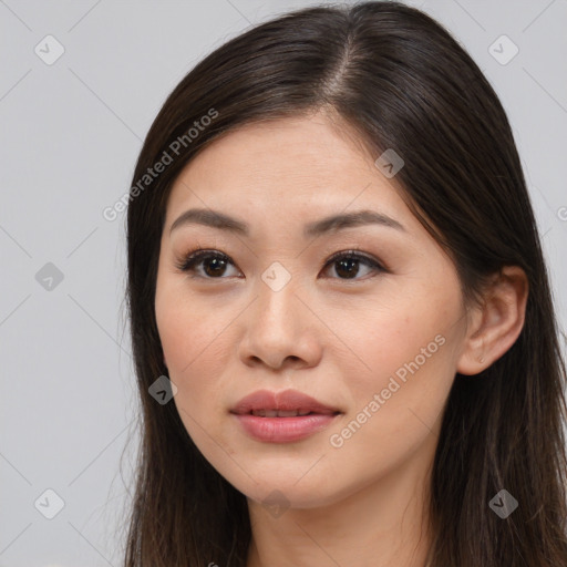 Joyful asian young-adult female with long  brown hair and brown eyes