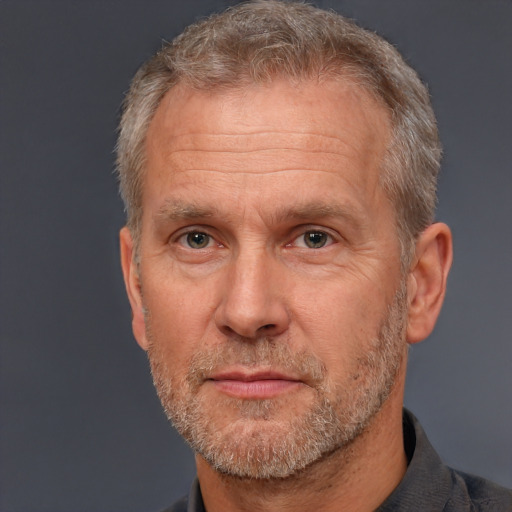 Neutral white middle-aged male with short  gray hair and brown eyes