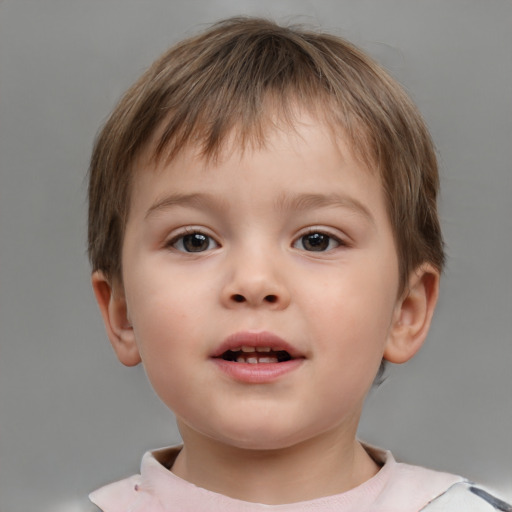 Joyful white child male with short  brown hair and brown eyes