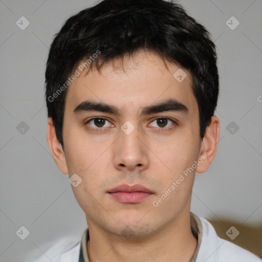 Neutral white young-adult male with short  black hair and brown eyes