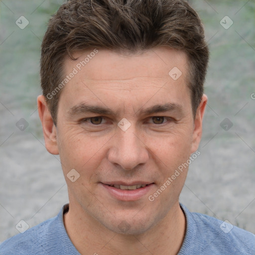 Joyful white adult male with short  brown hair and grey eyes